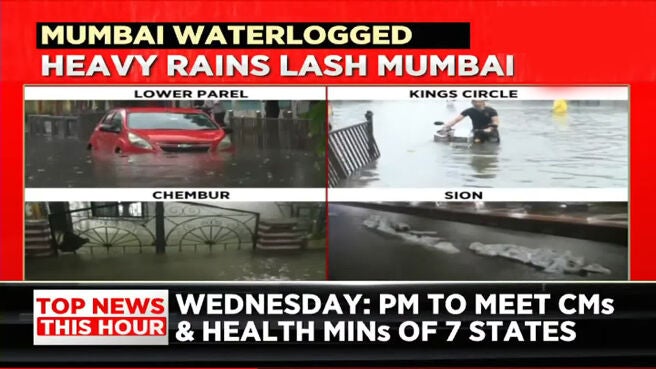 Watch Heavy Rains Lash Mumbai Waterlogged Streets Bring Traffic To Halt Train Services