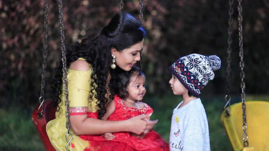 Shruthi plays with her kids