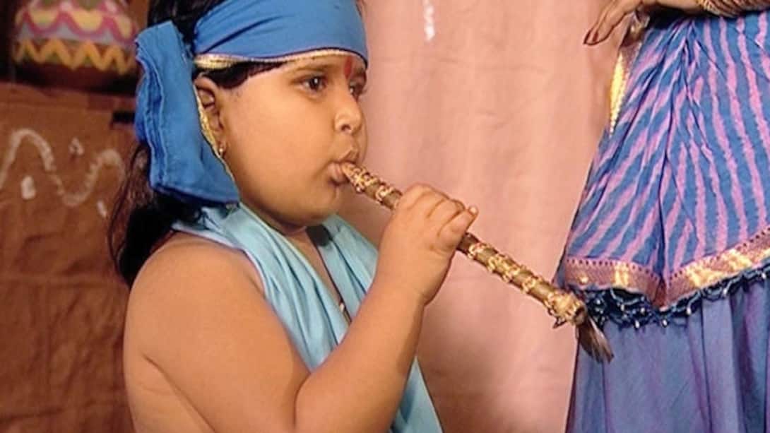A child imitates Krishna