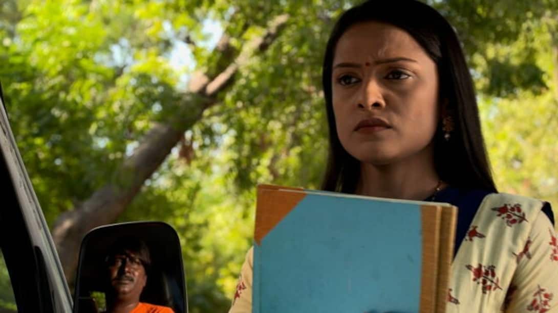 Will Dhara deliver the file to Majumdar?